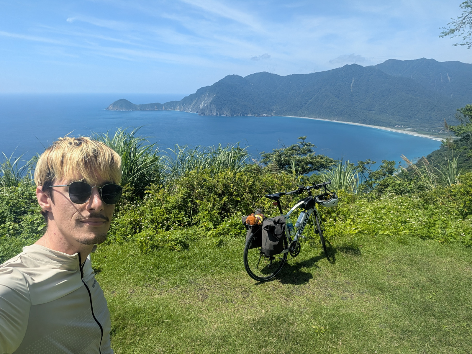 Andrew with his bike overlooking the Taiwan coastline